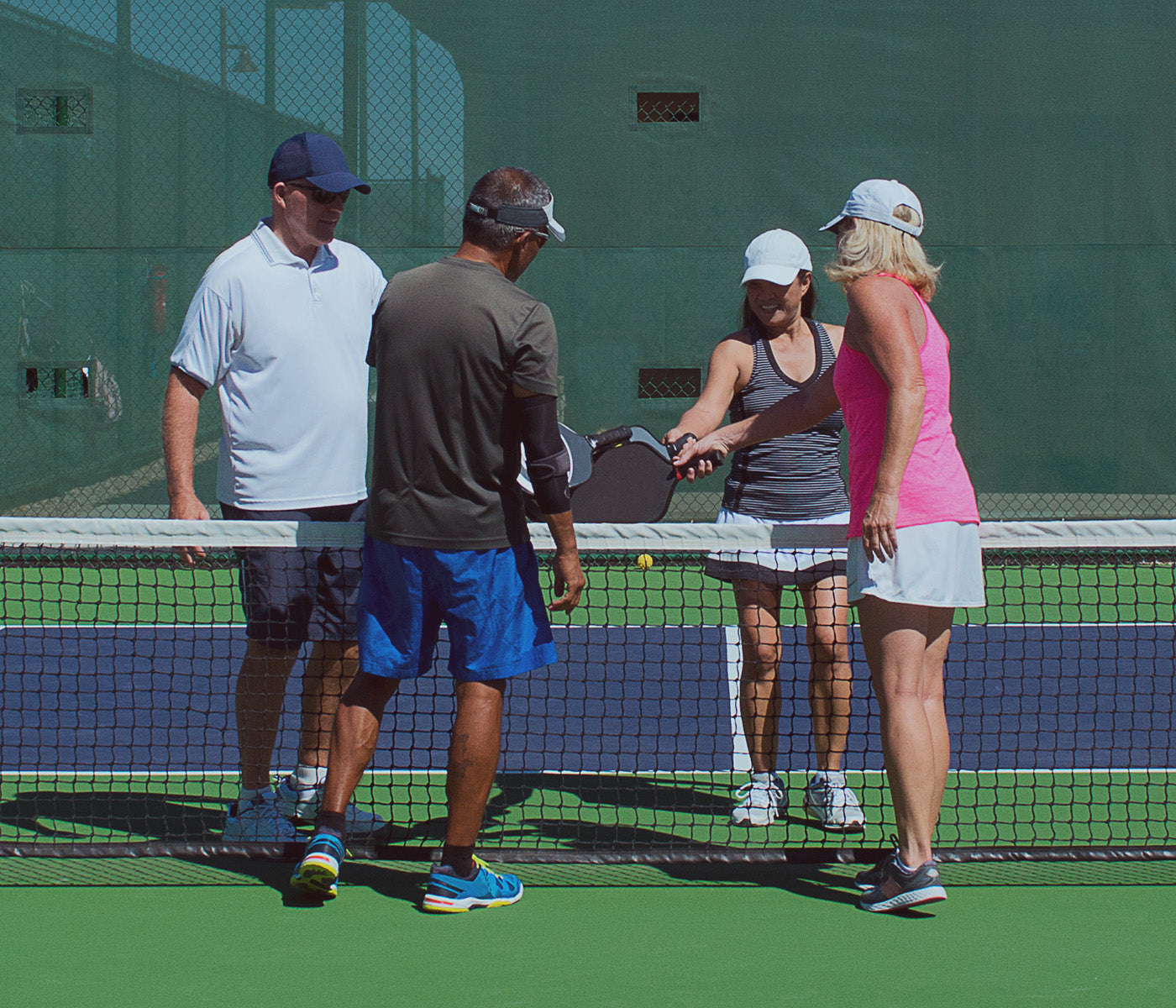 men and women playing pickleball